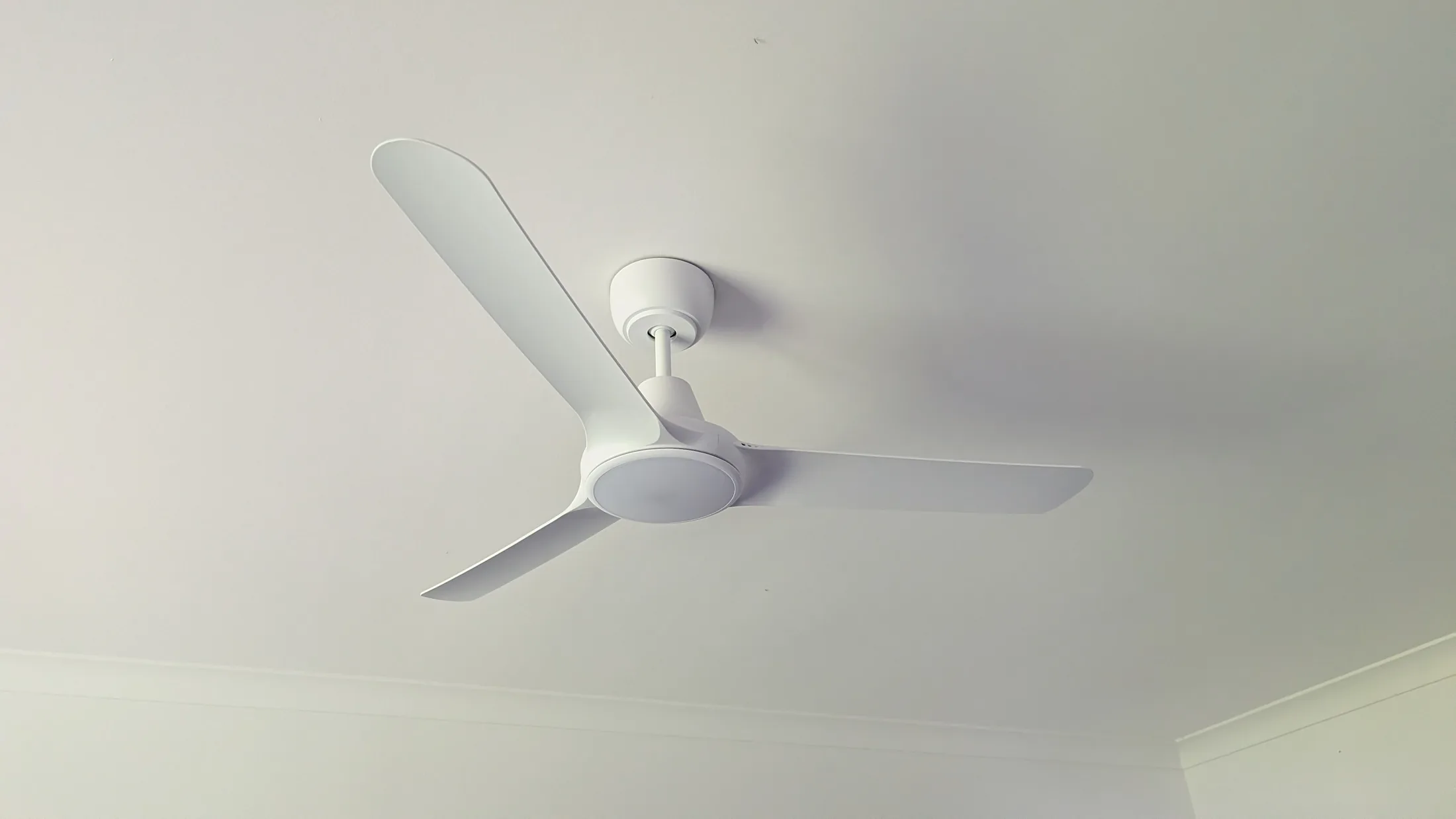 Modern white ceiling fan with integrated light