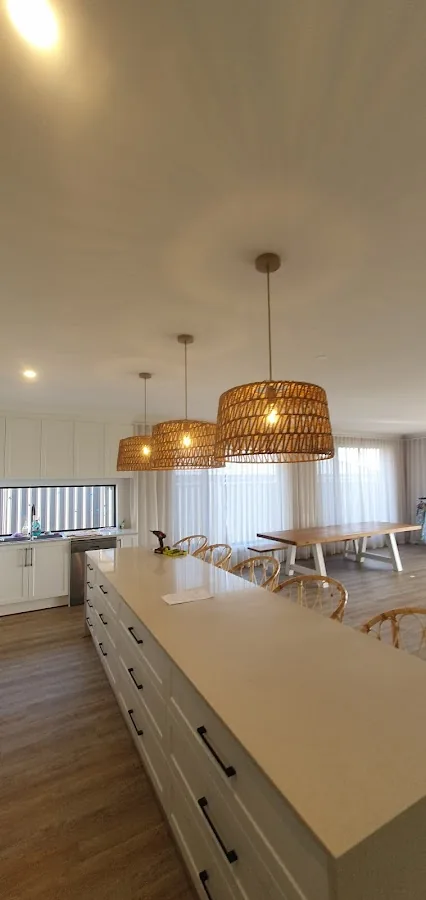 Coastal style kitchen with rattan pendant lights