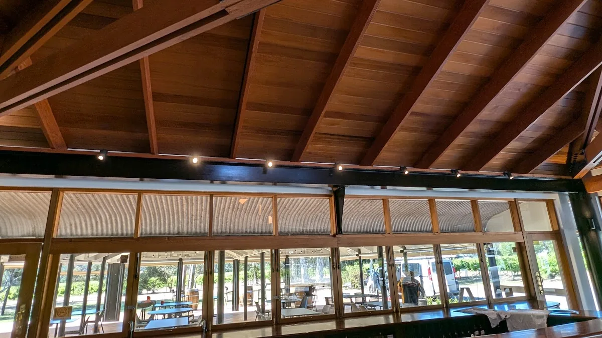 Timber ceiling with track lighting in commercial setting