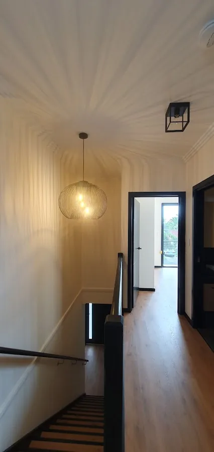 Hallway pendant and cage flush mount at stairwell