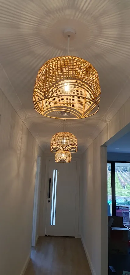 Hallway with rattan pendant lights casting decorative shadows