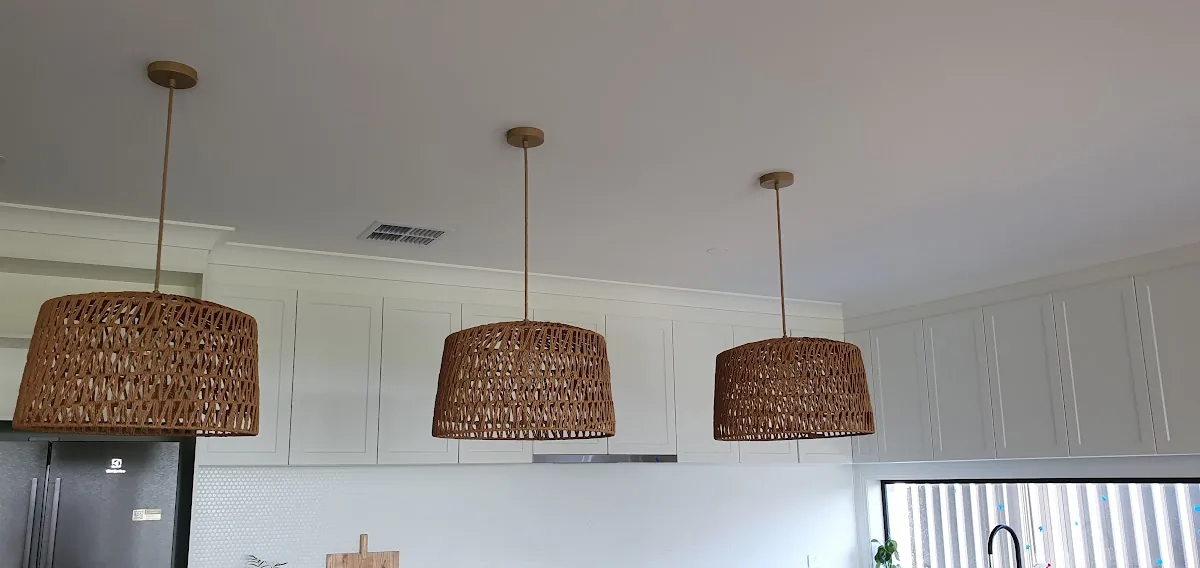 Rattan pendant lights over kitchen bench